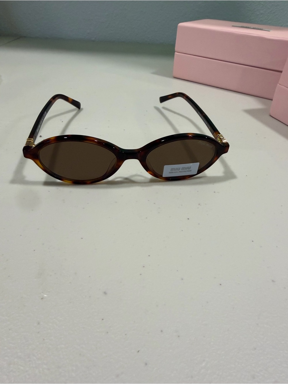 Miu Miu Tortoiseshell Oval Sunglasses with Brown Lenses
